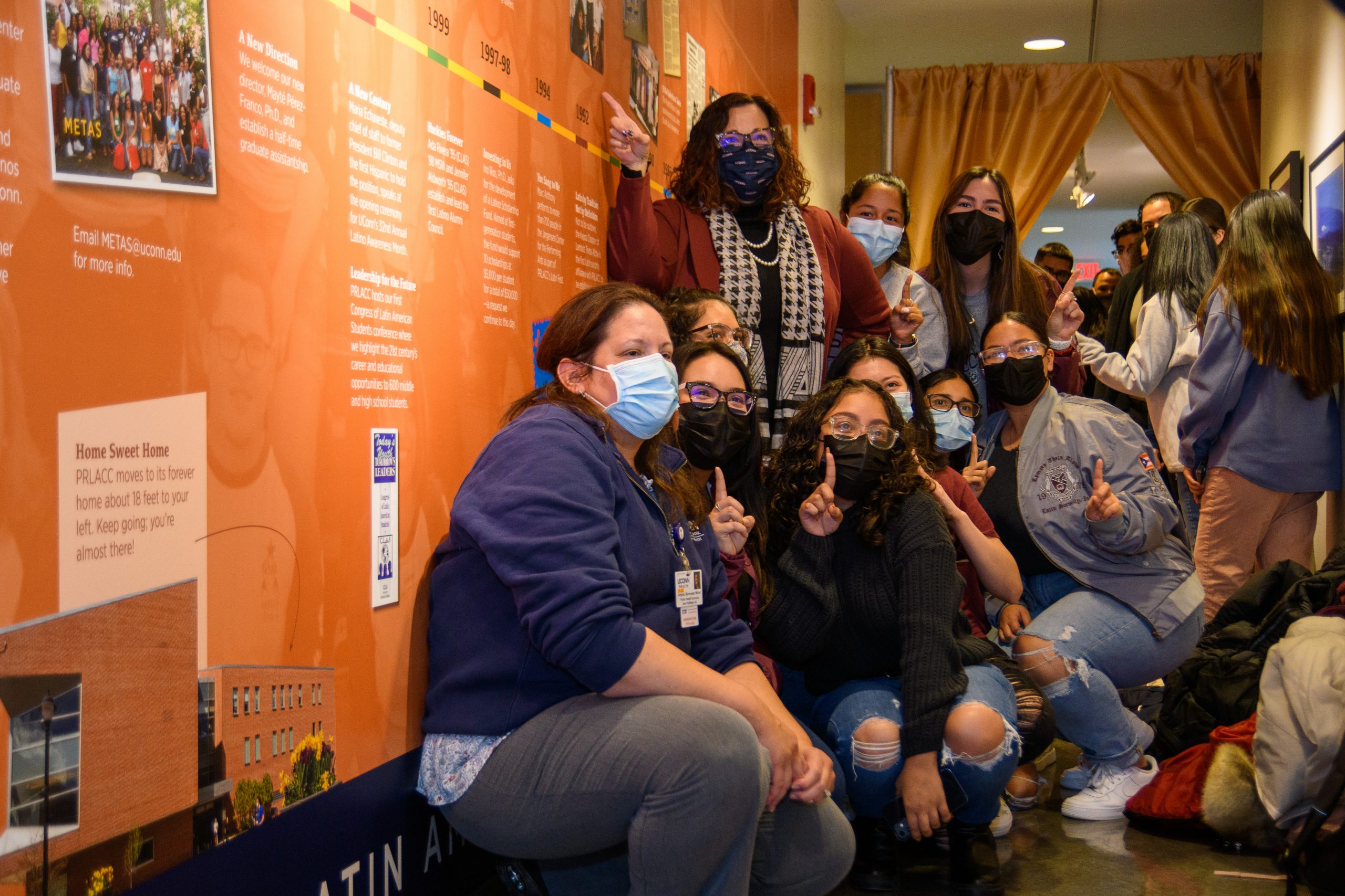Attendees react to the unveiling of the mural to commemorate the 50th anniversary of PRLACC on Dec. 10, 2021.