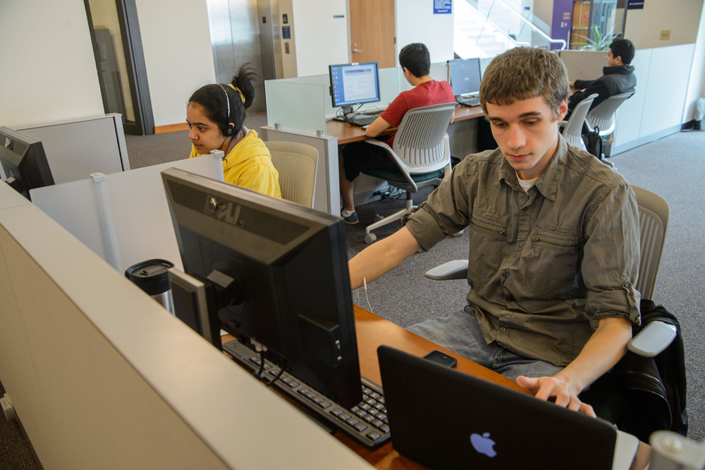 Students use computers at the Stamford campus library