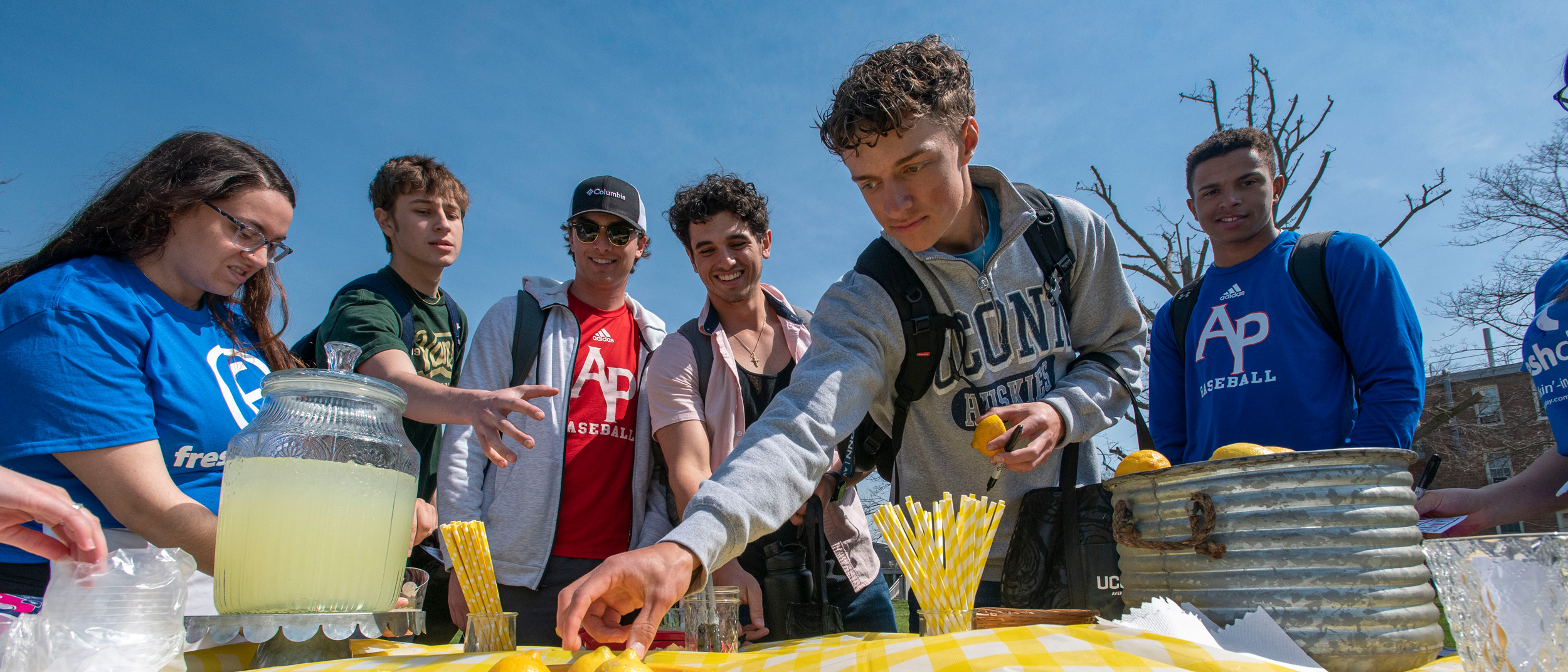 Students outdoors during an event at the UConn Avery Point campus.