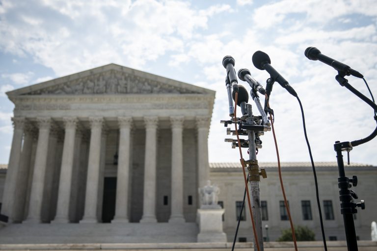 News microphones set up in front of the US Supreme Court in Washington DC.
