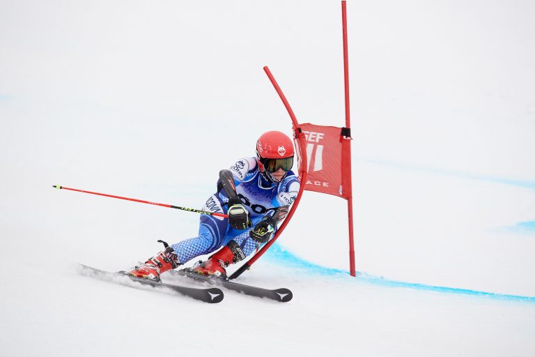 A downhill skier.
