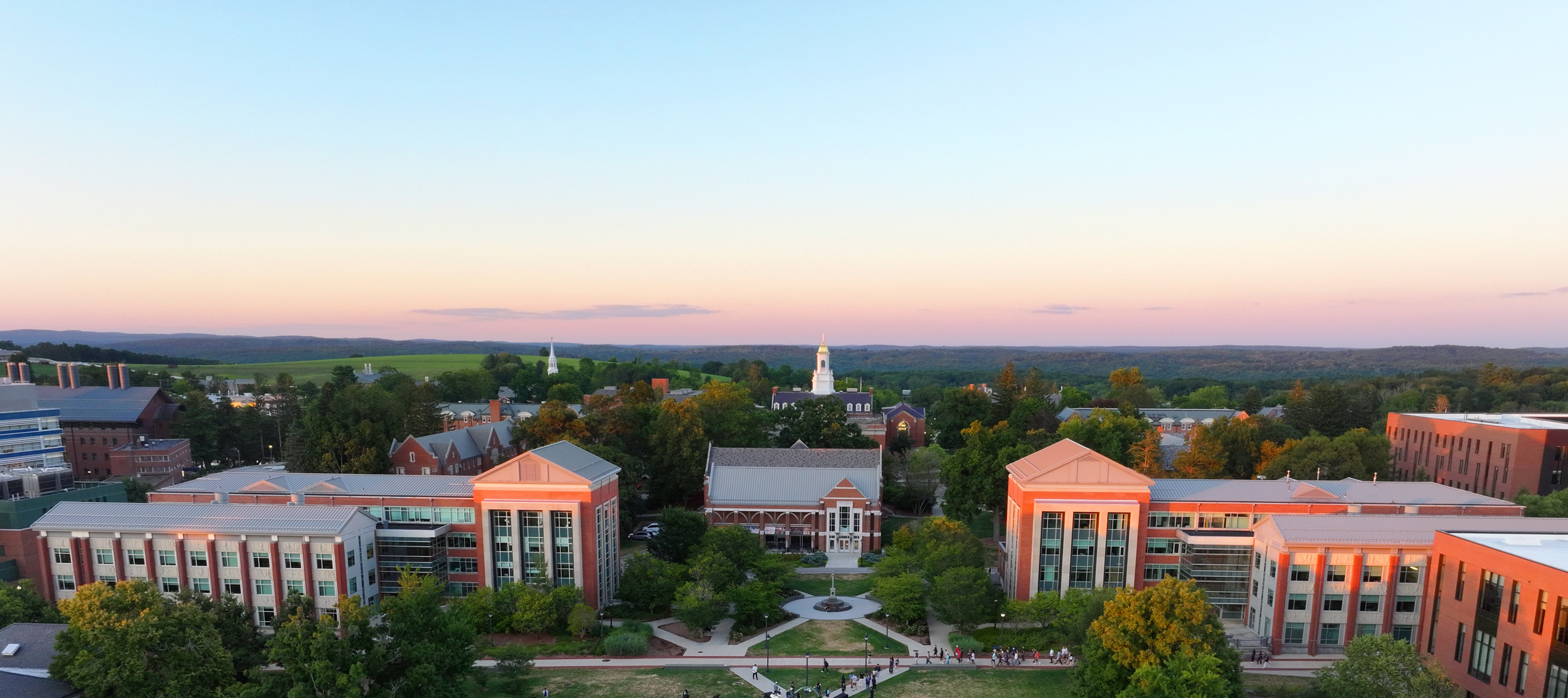 DJI_20250822193002_0074_D-crop Aerial view of UConn campus from the western side of campus looking east as sunset