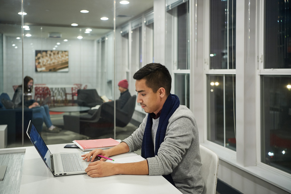 Brandon Garcia '12 (CLAS) studies in a lounge at the Stamford campus residence hall