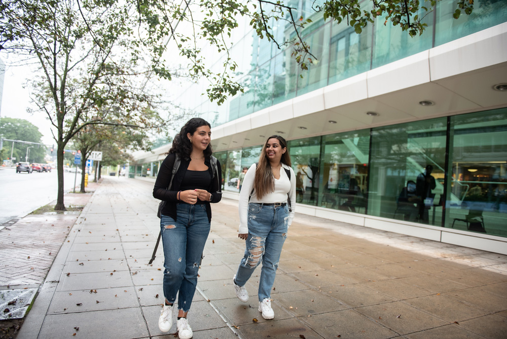 Female students walking outside UConn Stamford