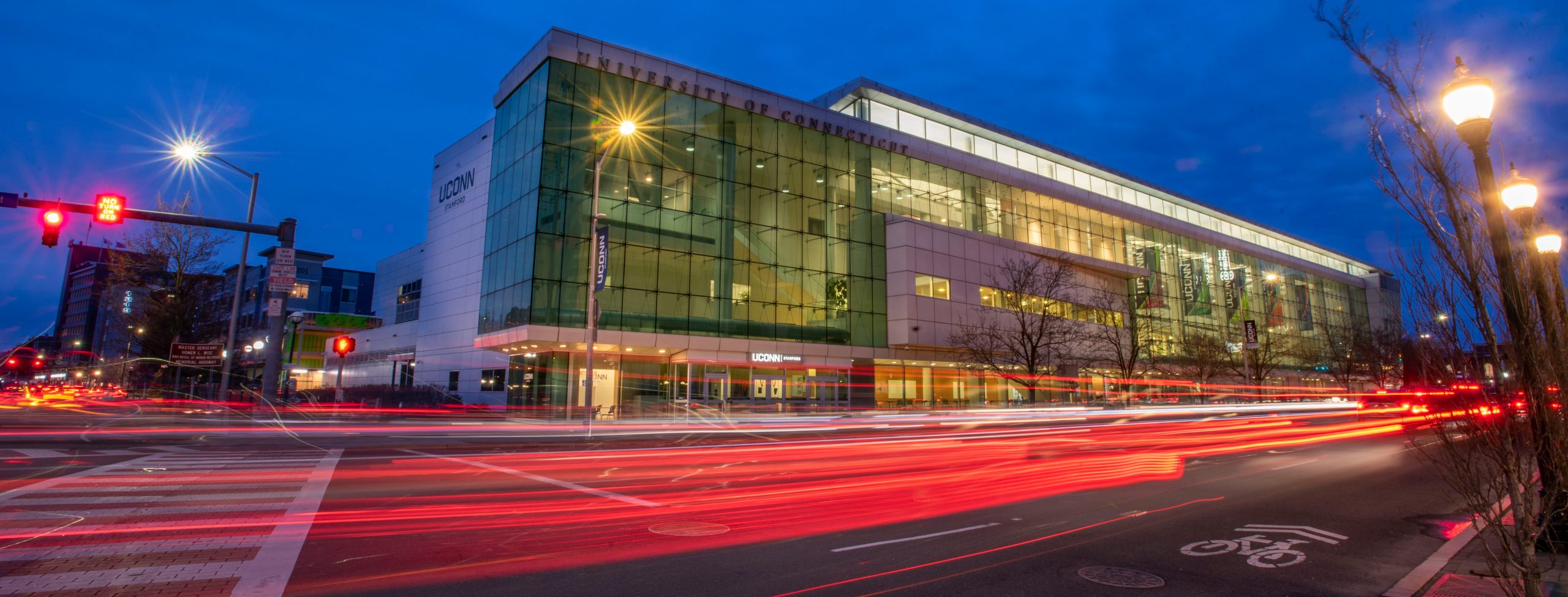 Exterior night views of traffic at the UConn Stamford campus.