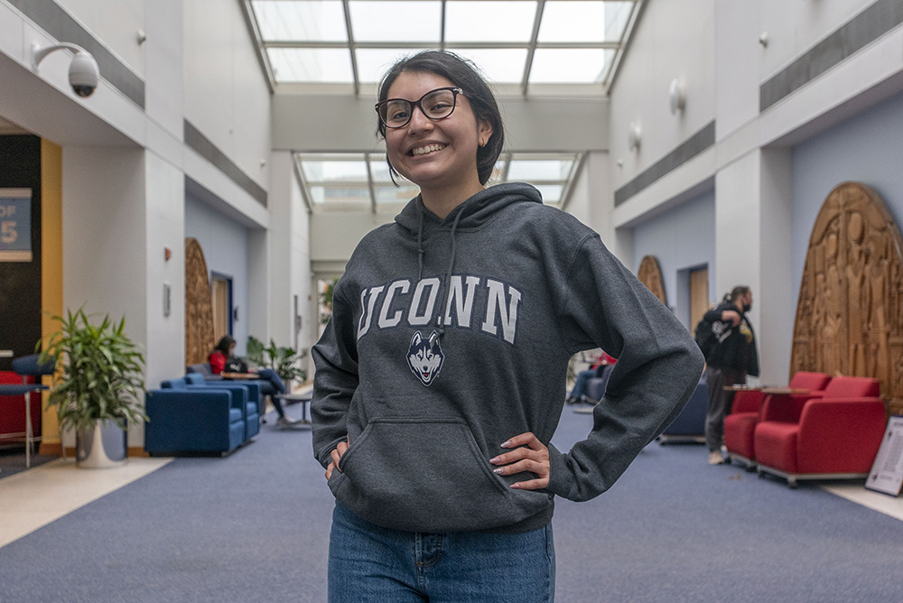 Proud UConn student poses for a portrait.