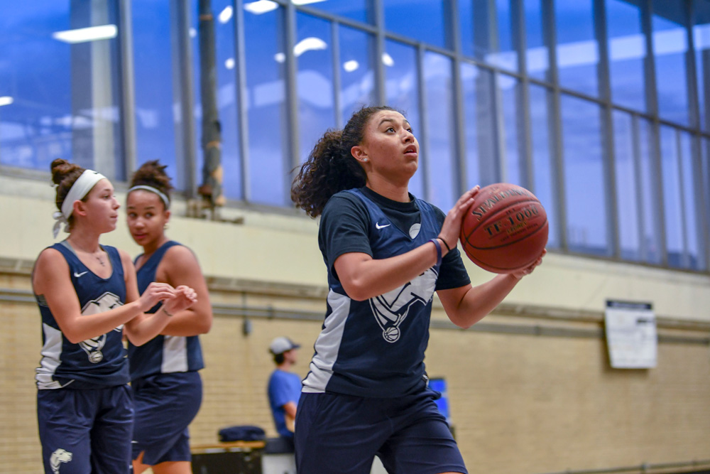 Members of the Division III Women's Basketball team practicing at Uconn Avery Point